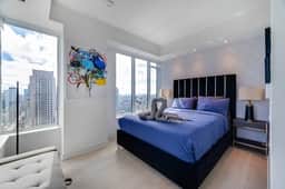 Yorkville Luxury • 2BR w/ City Views & Parking - Image 2