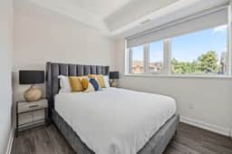 Sleek 2BR Den Townhouse | Parking & Views - Image 5