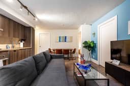 Sleek 3BR Retreat with Skyline Views - Image 2